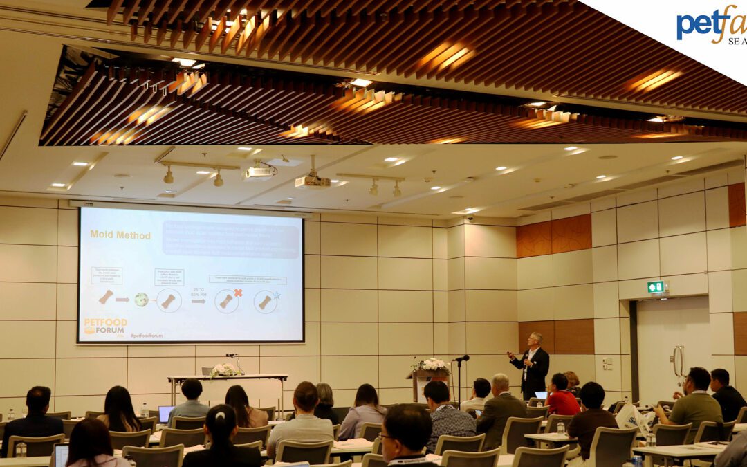 Male speaking in front of a classroom at Petfood Forum Asia