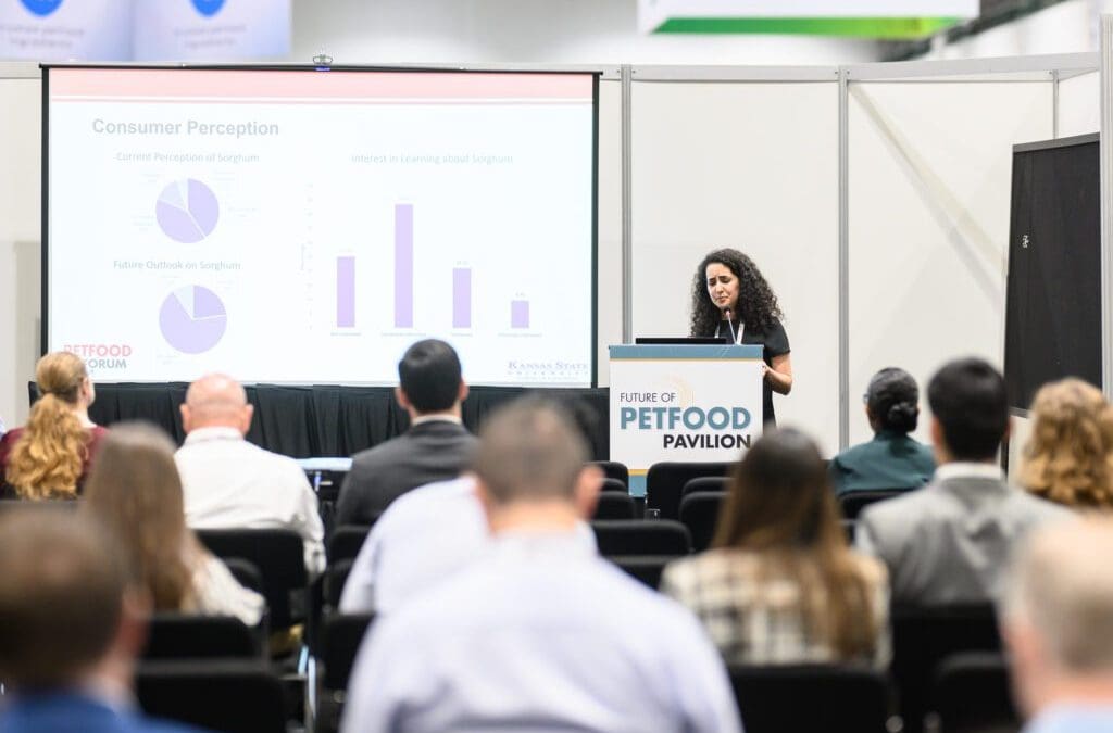 Female student presenting research at Petfood Forum