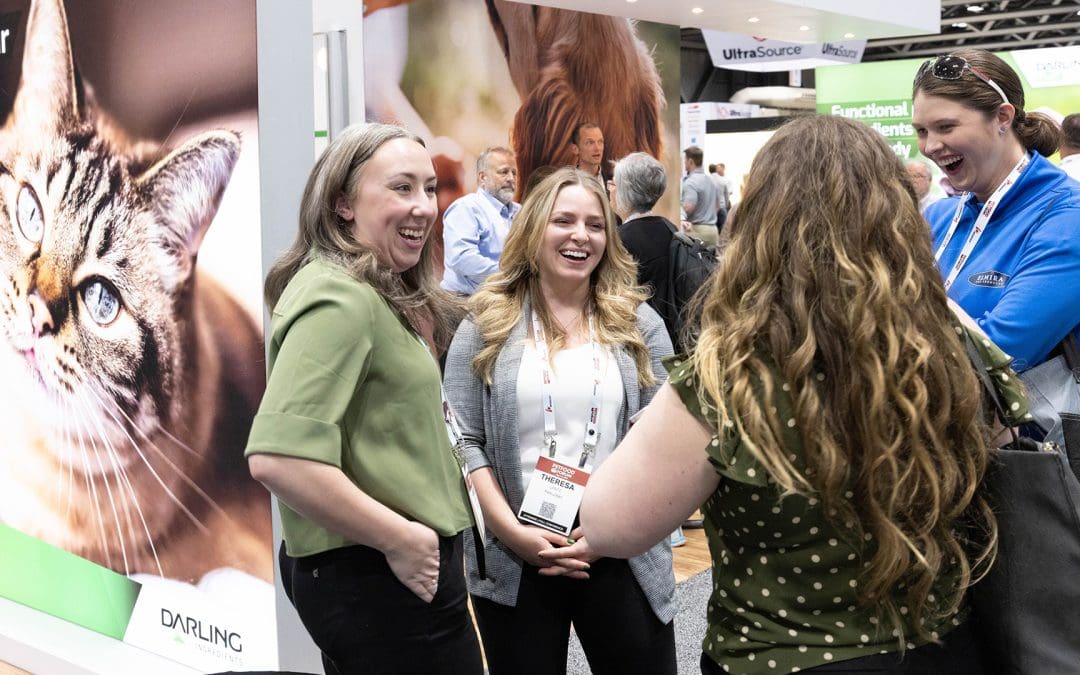 Petfood Forum female attendees standing in group smiling