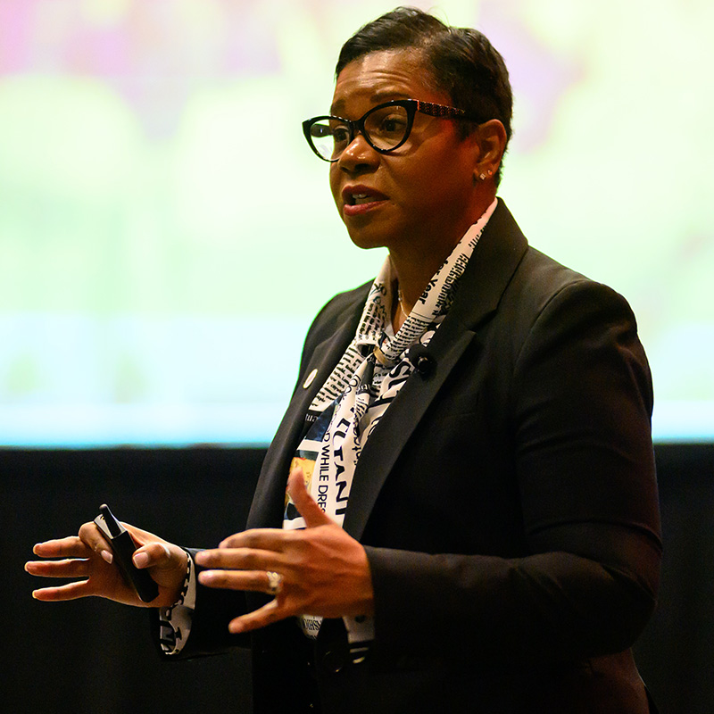 Black-female-speaker Black female speaker presenting at Petfood Forum