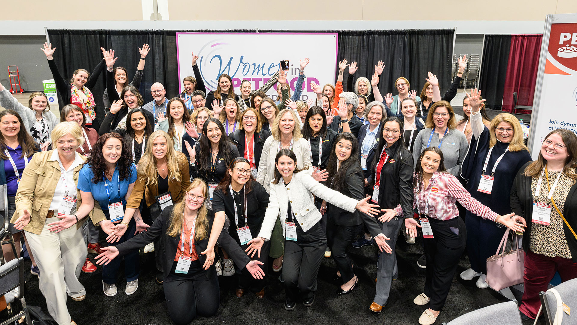 Large group of women posing together at Women in Petfood Leadership networking event