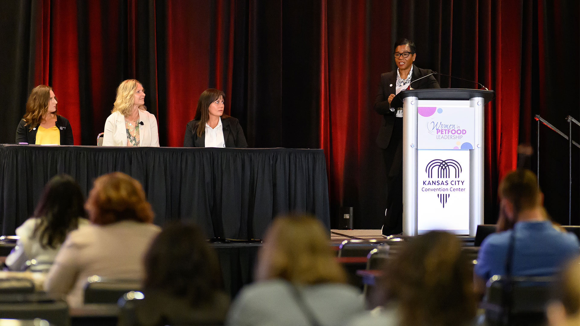Women presenting during a panel discussion at Petfood Forum