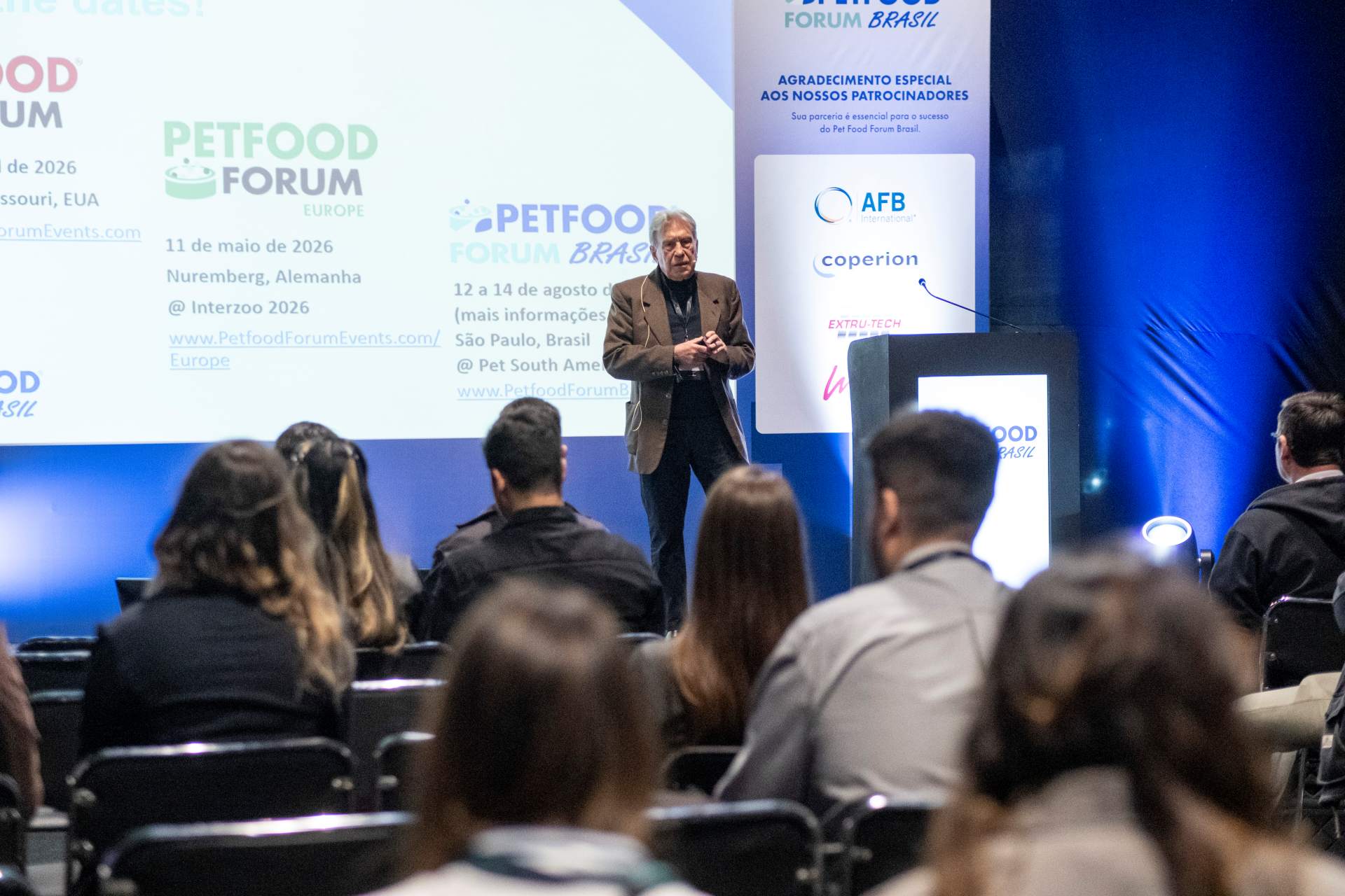 Male Speaker in front of crowd at Petfood Forum Brasil